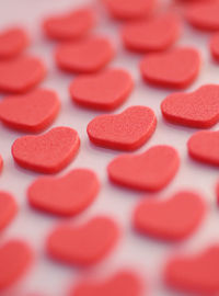 Close-up of red heart shaped candies on table