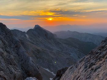 Scenic view of mountains against sky during sunset