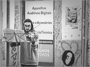 Close-up of woman standing on railroad station