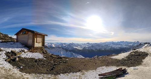 House of snowcapped mountains against sky