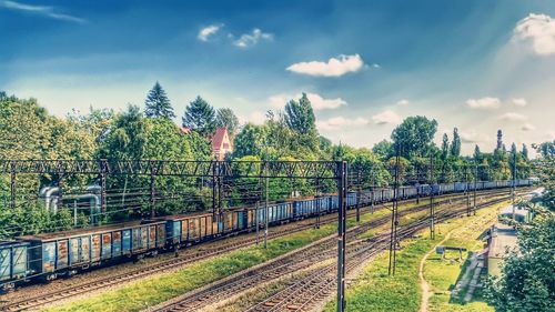 Train on railway tracks against sky