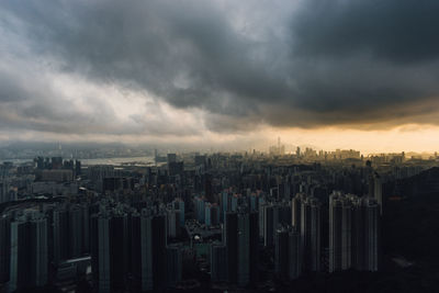 Cityscape against cloudy sky