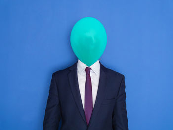 View of balloons against blue background