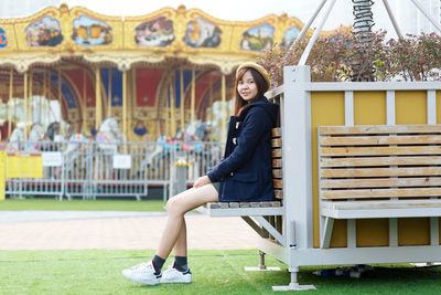 Portrait of smiling woman sitting on seat