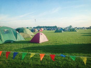 Tent on field against sky