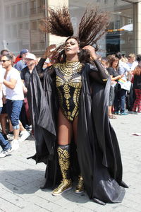 Woman standing on street in city