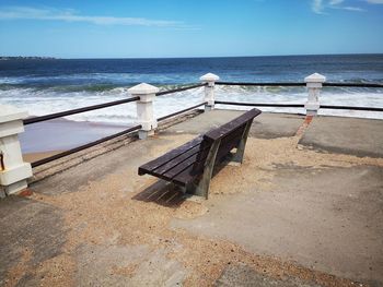 Built structure on beach against sky