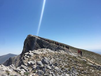 Scenic view of mountain against blue sky