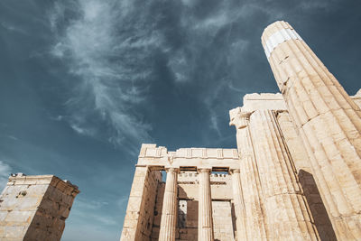 Low angle view of historical building against cloudy sky