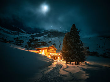 Scenic view of snowcapped mountains against sky during sunset, hotel in swiss alps moonshine 