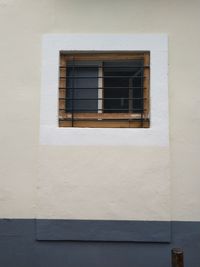 Low angle view of window on wall of building