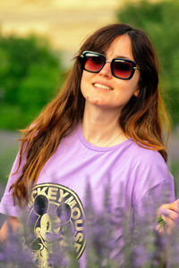 Portrait of smiling woman wearing sunglasses