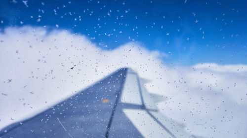 Ice flakes on glass window of a aircraft