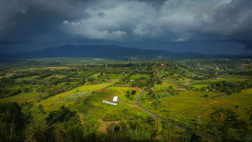 Scenic view of agricultural field against sky