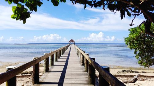 Pier over sea against sky