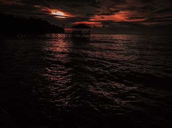 Scenic view of sea against sky at sunset