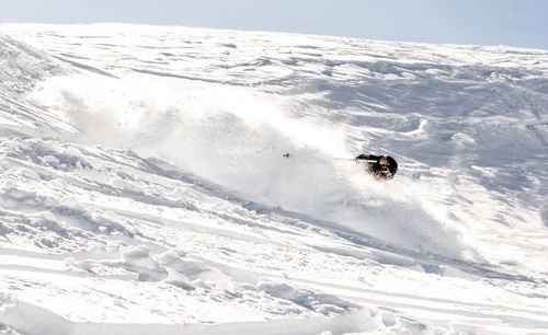 High angle view of person skiing on snowcapped mountain