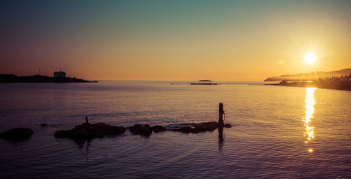 Scenic view of sea against sky during sunset