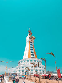 Low angle view of statue against blue sky