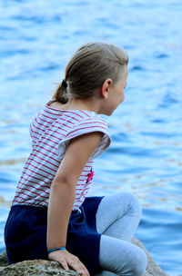 Girl sitting in sea