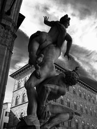 Low angle view of statue against cloudy sky