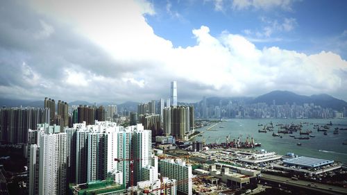 City skyline against cloudy sky