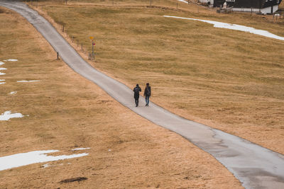 High angle view of couple standing on footpath