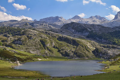 Scenic view of lake and mountains against sky