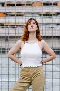 Urban portrait of a young woman in the middle of the city