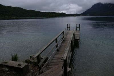 Pier over lake against sky