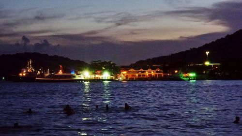 Reflection of illuminated buildings in water at night