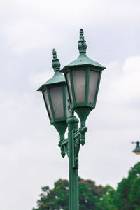 Low angle view of street light against sky