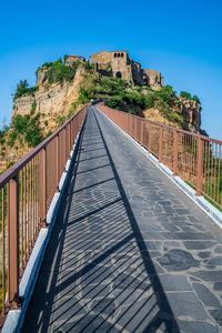 View of an abandoned building against blue sky