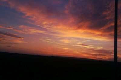 Silhouette of landscape against dramatic sky