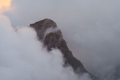 Scenic view of volcanic mountain against sky