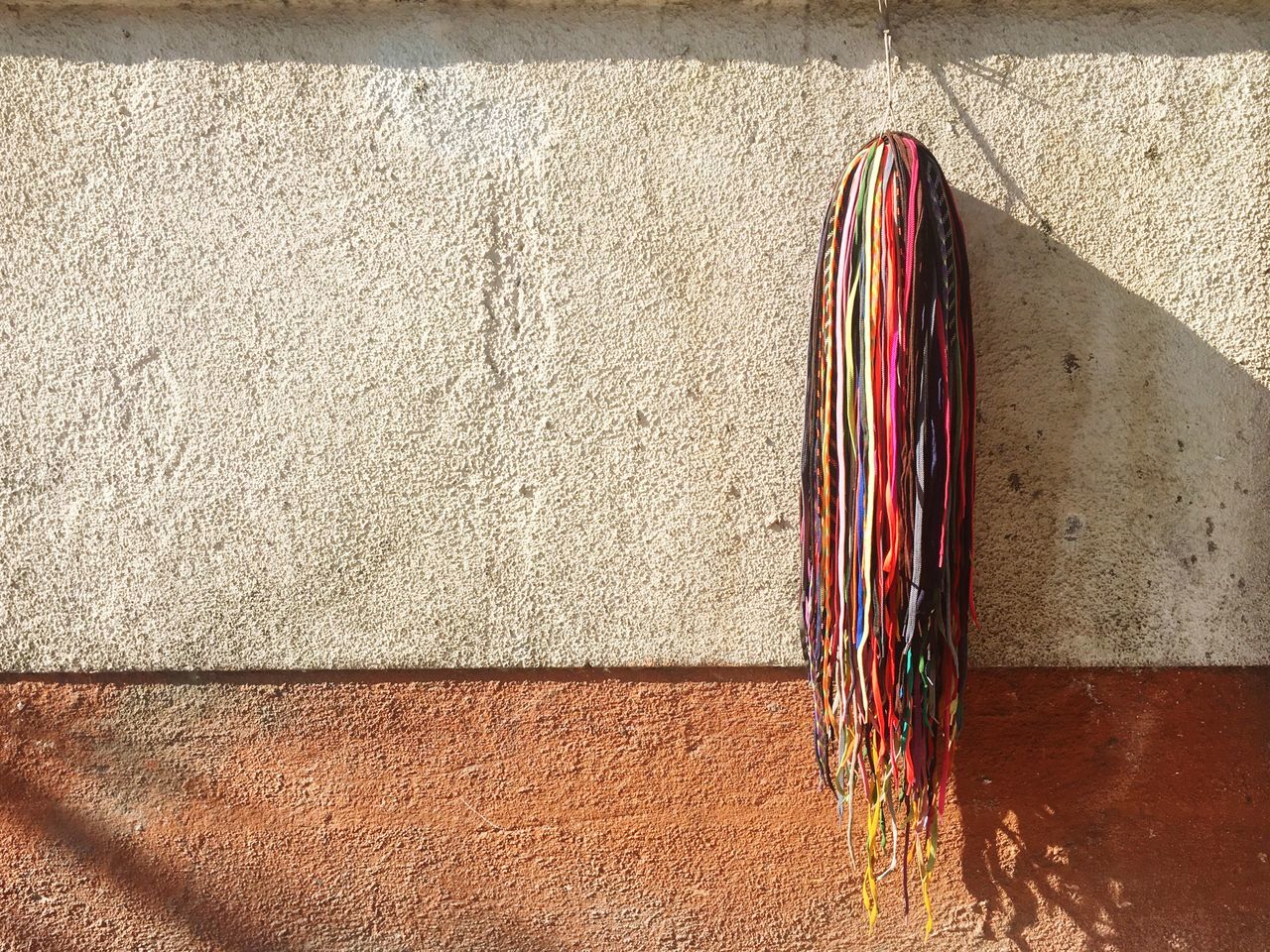 sunlight, shadow, no people, hanging, day, drying, outdoors, close-up, architecture