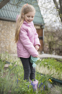 Portrait of cute girl with pink flowers