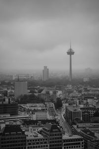 Cityscape against cloudy sky