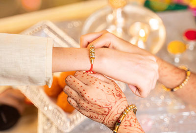 Close-up of woman holding hands