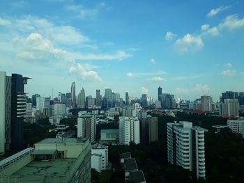 Panoramic view of buildings in city against sky