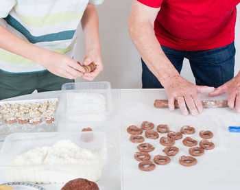 Father and son making christmas cookies