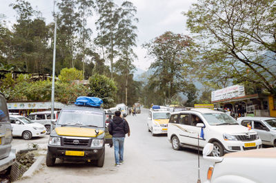 Rear view of vehicles on road