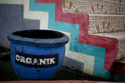 Close-up of text on metal wall