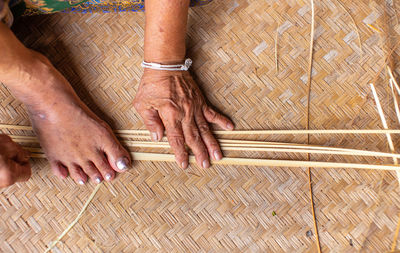 Close-up of man working in basket