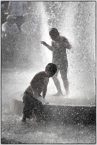 Woman with arms outstretched in background