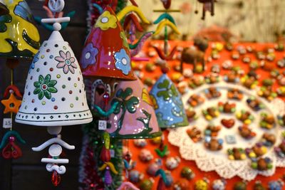 Close-up of decorations hanging for sale at market stall