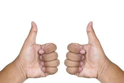 Close-up of human hand against white background