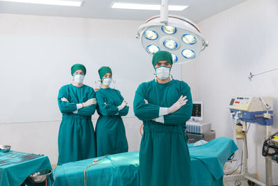 Healthcare and medicine. doctor posing with mask in the emergency room.