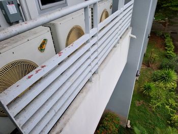 High angle view of empty chairs in yard