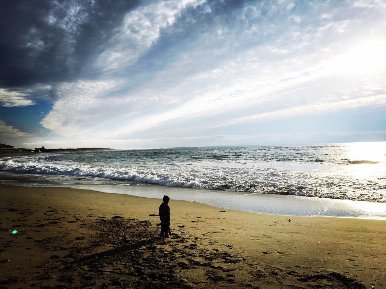 PEOPLE AT BEACH AGAINST SKY